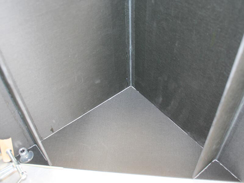 Interior detail image of the reaction structure. Looks down into a corner of the carbon fiber grid. Carbon is a unidirectional fiber.